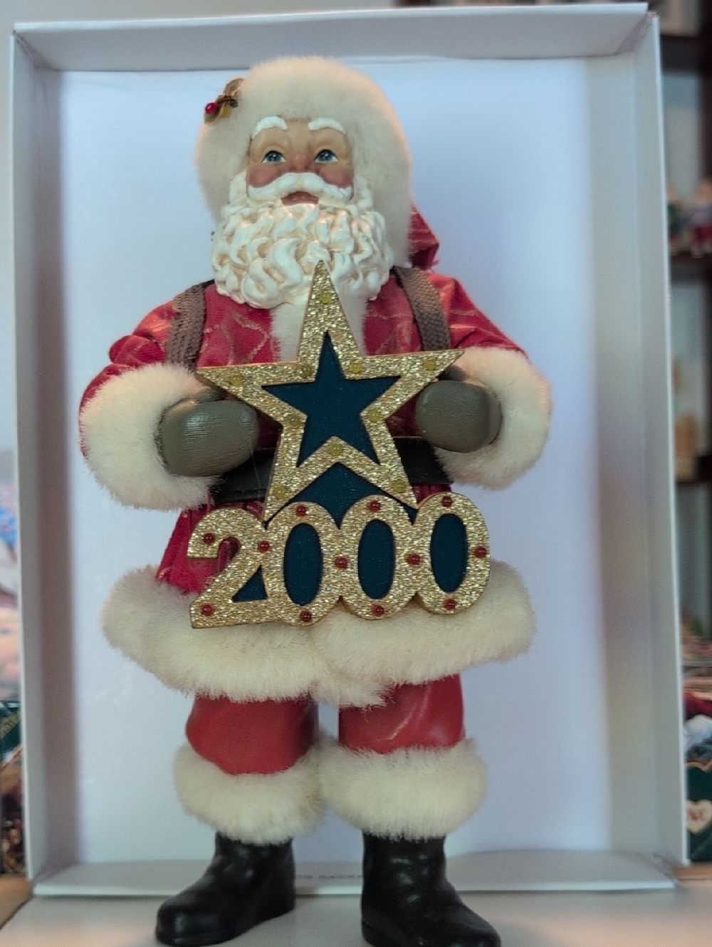 Festive Red Santa Figurine Holding 2000 Star Ornament